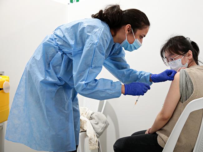 SYDNEY, AUSTRALIA- News Wire photos September 28 2021- Nan Hu, 27 (right) getting her first dose of Covid-19 vaccine at the Roseville vaccination clinic on the Pacific Hwy. Picture: NCA NewsWire / Adam Yip