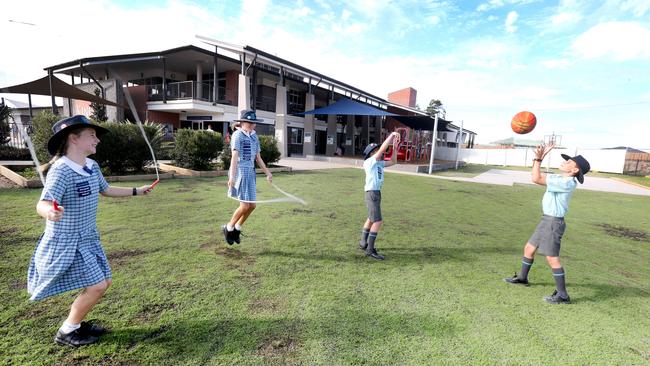 Students Emily Clark, 11, Ellis Petrucci, 11, Josh Day, 11, and Grant Garcia, 10, at their Kings Christian College in Pimpama. Picture: Mike Batterham