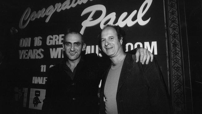 Paul Kelly (left) with Michael Gudinski, celebrating 16 years with Mushroom Records. Picture: supplied