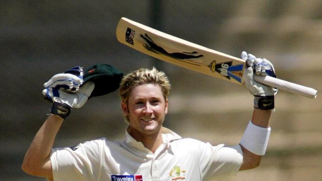 Cricket - Australia vs India Test match in Bangalore, India 07 Oct 2004. Batsman Michael Clarke raises his bat after completing his century on debut.