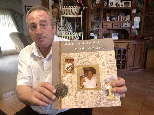 Vince Rotiroti holding photographs of his murdered father Salvatore Rotiroti. Picture: Keith Moor