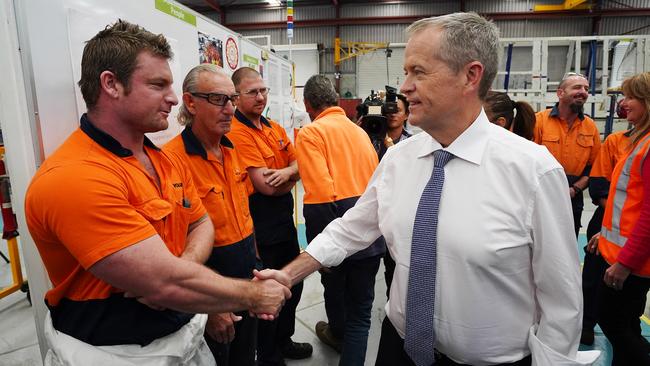 Opposition Leader Bill Shorten meets with workers during a visit to a Volgren Bus Australia facility. Picture: Getty Images