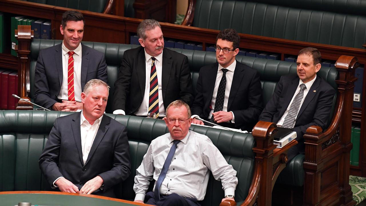 MPs Fraser Ellis (back left), Nick McBride (back right(, Steve Murray (second from right) and Dan Cregan (second from left), cross the floor in July, 2019. Pictured with MPs Troy Bell (front left) and Geoff Brock (right). Picture: Tom Huntley