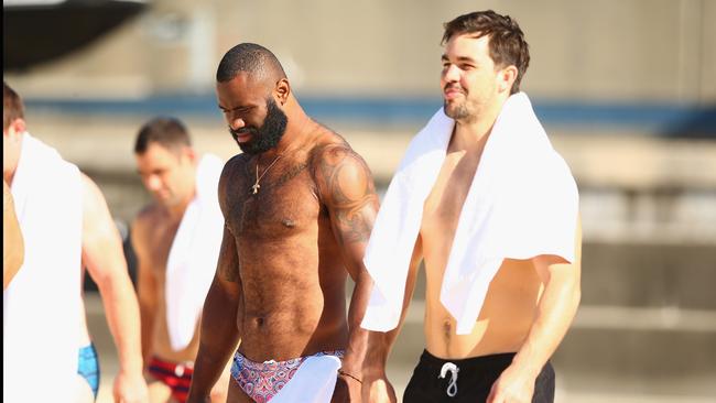 SYDNEY, AUSTRALIA - MAY 02: Semi Radradra and Aidan Guerra walk to the water during the Australia Kangaroos Test team recovery session at Coogee Beach on May 2, 2016 in Sydney, Australia. (Photo by Mark Kolbe/Getty Images)