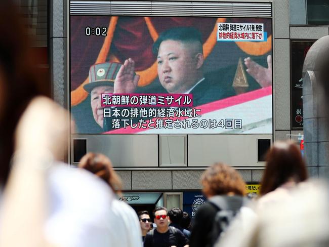 People watch news of North Korea’s latest ballistic missile launch that landed in Japan’s maritime economic zone. Picture: Meika Fujio/Kyodo News/AP