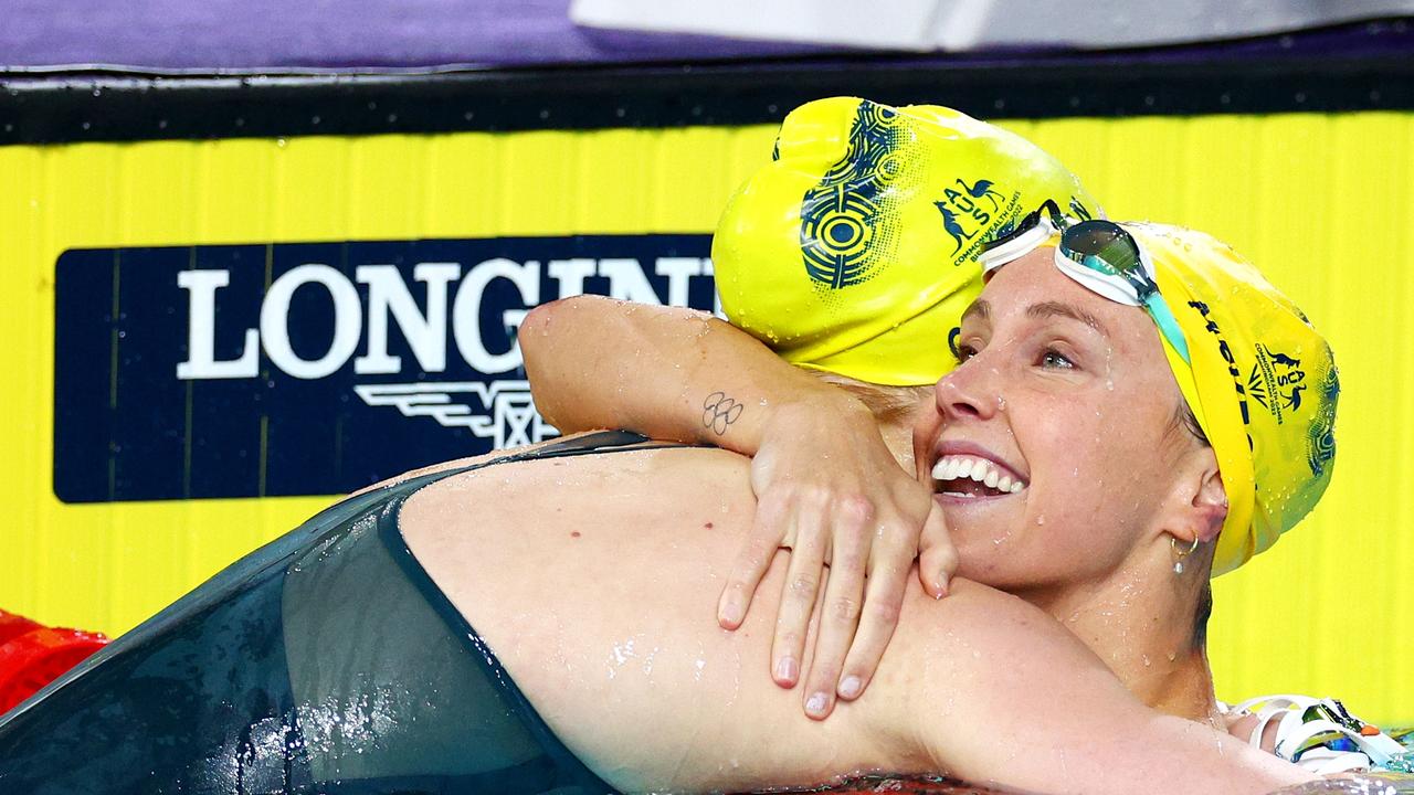 Emma McKeon embraces Mollie O’Callaghan after the race. Picture: Elsa/Getty Images