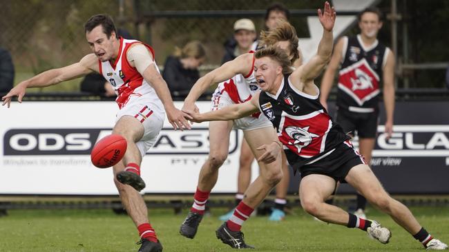 MPNFL: Marcus Gardner gets a kick away for Sorrento. Picture: Valeriu Campan