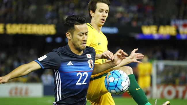 World Cup Qualifier,  Australia V's Japan at Etihad Stadium, Docklands, Melbourne Australia, 11th October  2016.   Maya Yoshida of Japan  battles with Australia's Robbie KrusePicture : George Salpigtidis