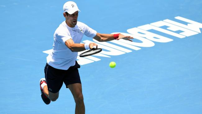 Novak Djokovic on the practice court at Melbourne Park on Sunday. The Serbian has had a more relaxed preparation for the Australian Open following the ATP Cup. Picture: AFP