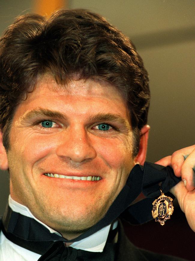 Footballer Robert Harvey with his 1998 Brownlow Medal.