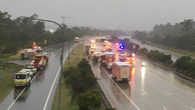 Emergency crews remain at the scene of a petrol tanker rollover at Helensvale. Picture: Taryn Davis