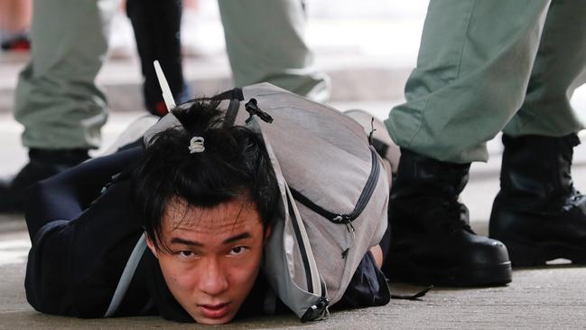 A man is detained by riot police during a march against China’s national security law. Picture: Tyrone Siu/Reuters