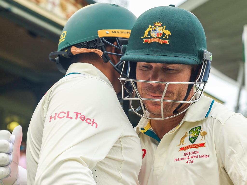 David Warner shares a hug with lifelong friend Usman Khawaja ahead of his penultimate Test innings. Picture: Mark Evans/Getty Images