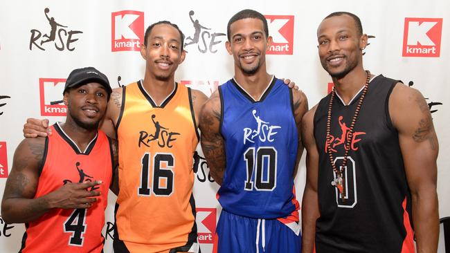 Guy Dupuy (centre right) and Chris Staples (right) attend 'A Whole Lotta Awesome' At the Re-Grand Opening of a Revitalized Kmart Store.