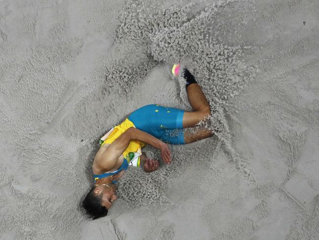 Australia's Fabrice Lapierre lands after a long jump attempt.