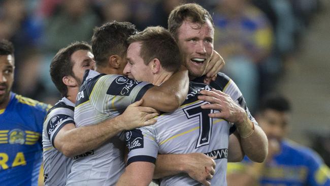 Cowboys players celebrate a Michael Morgan try against the Eels.