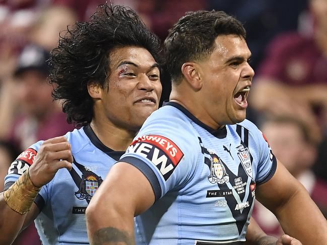 TOWNSVILLE, AUSTRALIA - JUNE 09:  Latrell Mitchell of the Blues celebrates with team mates after scoring a try during game one of the 2021 State of Origin series between the New South Wales Blues and the Queensland Maroons at Queensland Country Bank Stadium on June 09, 2021 in Townsville, Australia. (Photo by Ian Hitchcock/Getty Images)