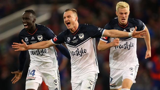 Besart Berisha, centre, celebrates Melbourne Victory’s grand final win over Newcastle in 2018. Picture: Getty Images