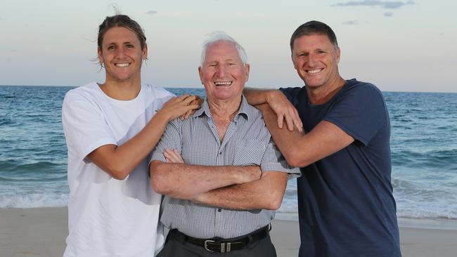 GCB COAST WEEKEND ONLY DO NOT USE Trevor Hendy with his father Ron Hendy and his son TJ Hendy ,all Surfers Paradise SLSC members and two (Trev and Ronald) club presidents. Picture Glenn hampson