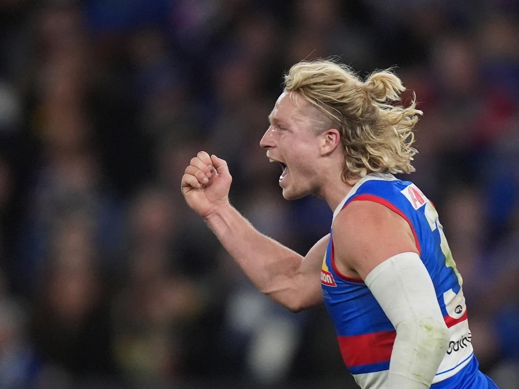 MELBOURNE, AUSTRALIA - JUNE 29: Cody Weightman of the Bulldogs celebrates kicking a goal during the round 16 AFL match between North Melbourne Kangaroos and Western Bulldogs at Marvel Stadium, on June 29, 2024, in Melbourne, Australia. (Photo by Daniel Pockett/Getty Images)