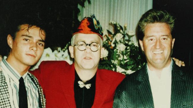 Undated copy photo of Ikin's partner Alex Despallieres (L), singer Elton John and music executive Peter Ikin.