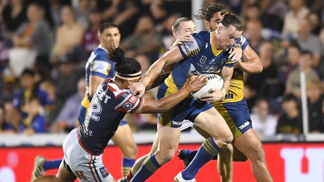 Clint Gutherson tries to crack the Roosters’ defence. Picture: Albert Perez/Getty Images