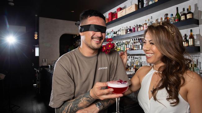 Vanna Nguyen and George Magnisalis experience a blindfolded cocktail tasting at new Hindley St bar, Nyx. Picture: Brett Hartwig