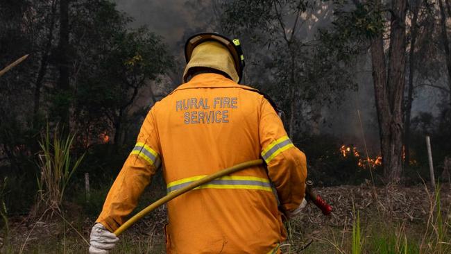 A Queensland Rural Fire Service volunteer in the field.