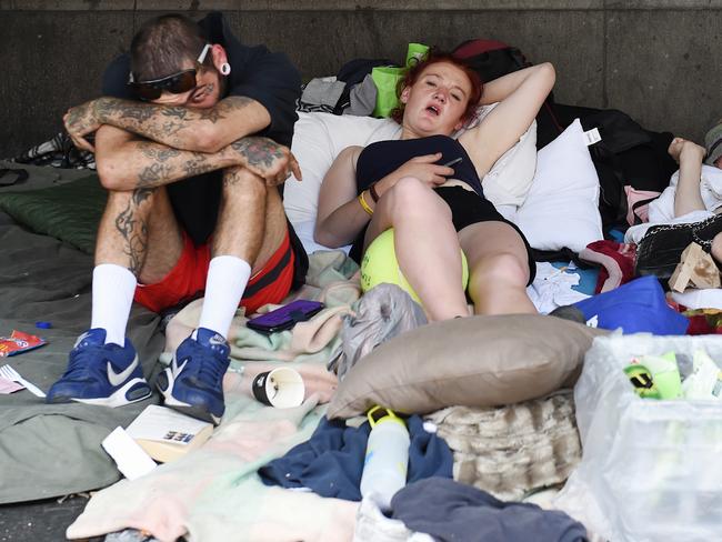 People setting up a makeshift camp outside Flinders St station. Picture: Nicole Garmston