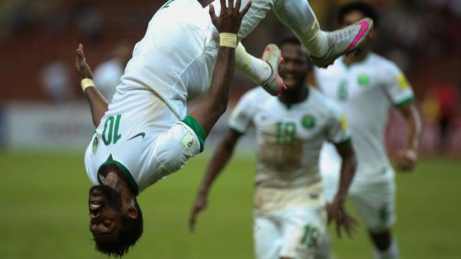 Nawaf Alabid of Saudi Arabia celebrates a goal against Iraq.