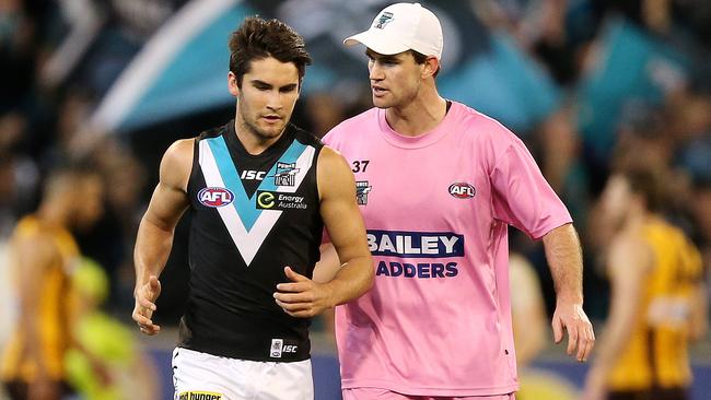 Chad Wingard getting instructions from a runner. Picture: Sarah Reed