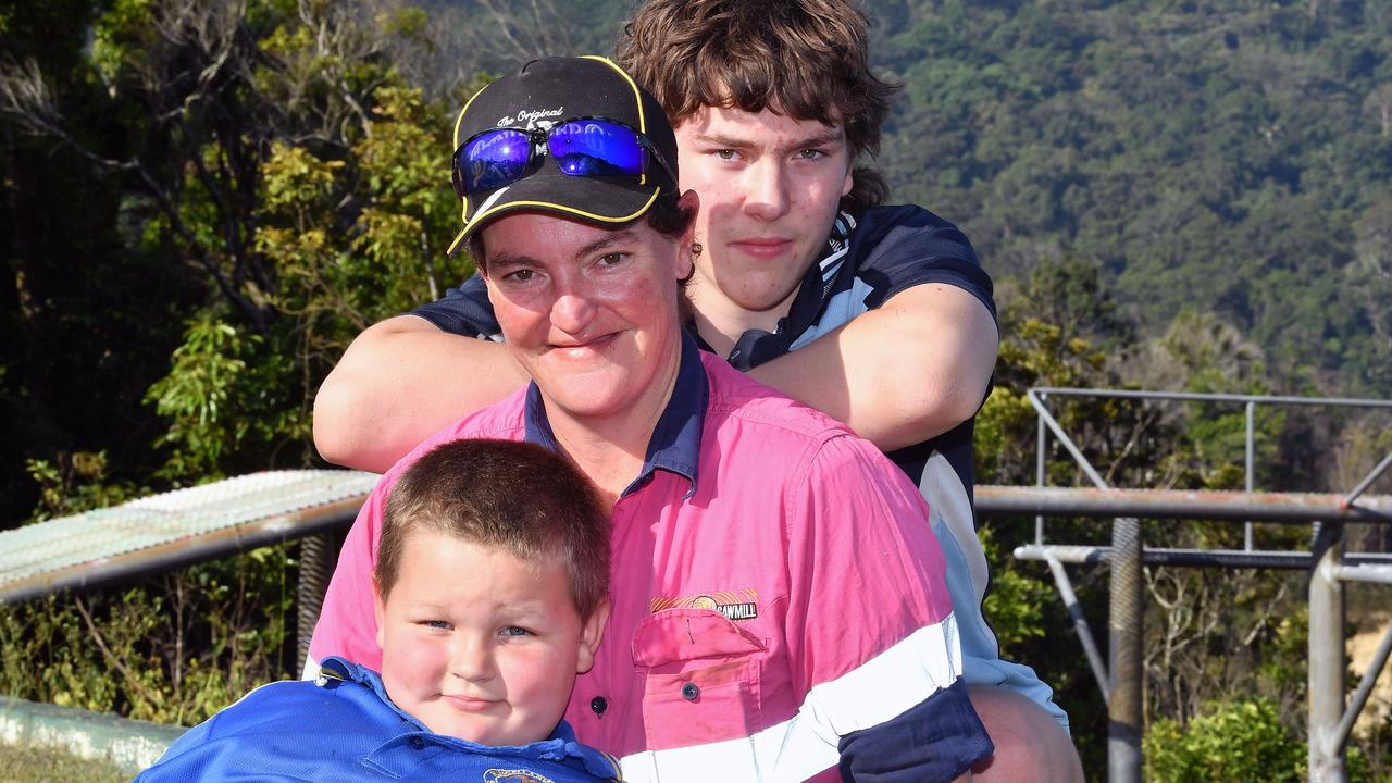 Eungella resident Jo Freegard with William Smith, 15, and Ben Smith,6, one year on from the Eungella fires. Picture: Tony Martin