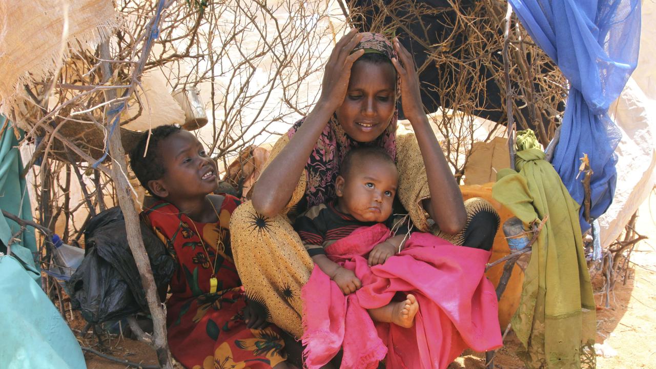 Former farmer Habiba Osman Ahmed in Dollow refugee camp in southern Somalia in 2011. After Somalia's 20-year civil war pushed the drought into famine she didn’t even have a pot to cook in, and had to share with another family.
