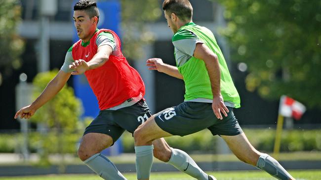 Socceroos training at Olympic Park, (L) Massimo Luongo gets around (R) Terry Antonis. Melbourne. 3rd January 2015. Picture: Colleen Petch.