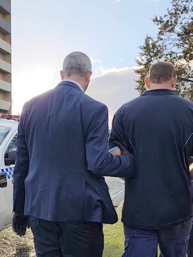 Coffs detectives arresting the man on Tuesday. Picture: NSW Police