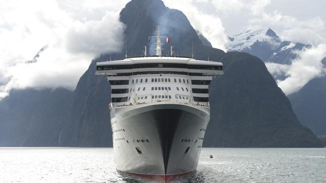 *****EXCLUSIVE IMAGES*******FREE IMAGES FOR USE IN EDITORIAL AND ONLINE USE ONLY - MANDATORY CREDIT - PICTURES BY JAMES MORGAN WHERE USED OR ISSUED - Off the coast of Benoa Harbour, Bali, Indonesia - Sunday 2nd. March 2014 MASTER AND COMMANDER Captain Kevin Oprey stands beneath the soaring hull of Cunard's flagship Queen Mary 2, the largest and most expensive Ocean Liner ever built, a mile off the coast of Bali on Sunday during the ship's Round World Voyage in its 10th anniversary year. Captain Oprey surveys the scene from the top of Queen Mary 2's bulbous bow, an underwater projection that minimises the creation of bow waves around the waterline when the ship is under way. Two safety craft were standing by during the photo-shoot, but Captain Oprey remained sure-footed throughout. Queen Mary 2 will make her 10th call at Sydney on Friday 14 March after circumnavigating Australia, and then heads north towards Shanghai, Hong Kong, Ho Chi Minh City, Bangkok and Singapore before turning west for Sri Lanka and Dubai, entering the Mediterranean through the Suez Canal and returning to the UK in time to mark the 10th anniversary of becoming Cunard's flagship, with sister ships Queen Elizabeth and Queen Victoria joining in the celebrations in Southampton on 9 May 2014. At 151,200 tons, Queen Mary 2 accommodates 2,620 passengers and 1,253 crew. In her first 10 years of operation, following a spectacular naming by Her Majesty The Queen on 8 January 2004, Queen Mary 2 has undertaken more than 420 voyages including over 200 Transatlantic Crossings and called at 182 ports in 60 countries. She remains the longest, tallest, widest ocean liner ever built as well as being the most famous and fastest passenger ship in operation today. For Further PRESS Information Michael Gallagher, Public Relations Manager: 0207 940 5391 michael.gallagher@cunard.co.uk 07770 546 283 Gill Ha