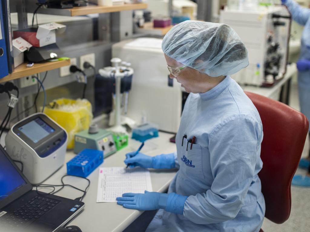 Queensland University scientists working in the lab on a coronavirus vaccine.