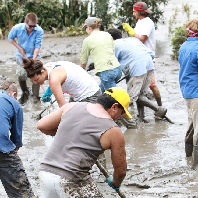 Brisbane’s flood army gets stuck in at West End. Picture: Henry Poloai.