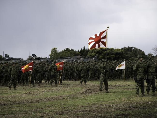 Soldiers of Japanese Ground Self-Defense Force (JGSDF), the  brand-new Marinesnamed The Amphibious Rapid Deployment Brigade attend a ceremony in Camp Ainoura in Sasebo, Nagasaki Prefecture, Japan on April 7, 2018, as Japan seeks to expand the the military defend against North Korea's nuclear and missile programs and China's maritime assertiveness over theSenkaku Islands. The launch of the Ground Component Command to provide unified command over regional armies and the Amphibious Rapid Deployment Brigade, Japan's version of the U.S. Marines. (Photo by Richard Atrero de Guzman/NurPhoto via Getty Images)