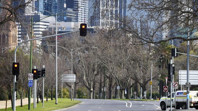 An almost deserted city street in Melbourne. Picture: Andrew Henshaw