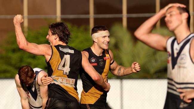 Tom Schnerring (L) and Brayden Sier of Heidelberg celebrate on the final siren. Photo: Hamish Blair