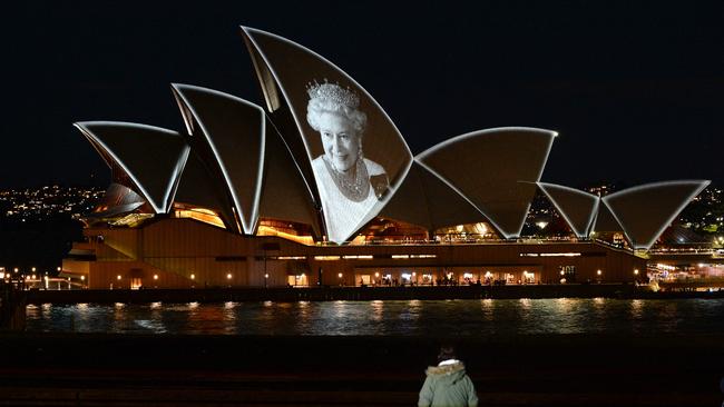 The Opera House sails were lit up with the picture of Queen Elizebeth II to commemorate her life, but there will be no tribute to King Charles III. Picture: Muhammad Farooq/AFP.