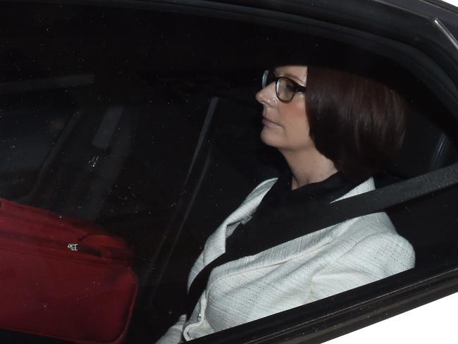 Former prime minister Julia Gillard departs after giving evidence at the Royal Commission. AAP Image/Paul Miller.