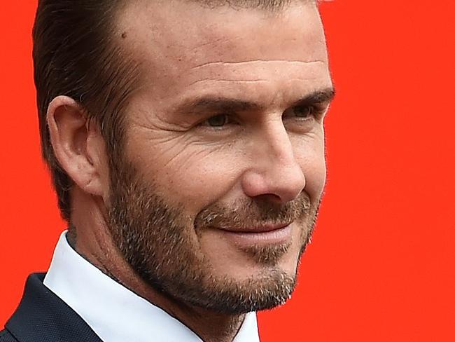 (FILES) This October 6, 2015 file photo shows former Manchester United and England footballer David Beckham as he poses on the pitch at Old Trafford in Manchester, north west England ahead of a charity football match in aid of UNICEF. David Beckham has barely found a new stadium site for his Miami-based Major League Soccer expansion team, and he already says he wants to sign Swedish star Zlatan Ibrahimovic.Beckham told Swedish newspaper Aftonbladet that he is interested in the Paris Saint-Germain striker, according to a posting on the MLS website.AFP PHOTO/PAUL ELLIS