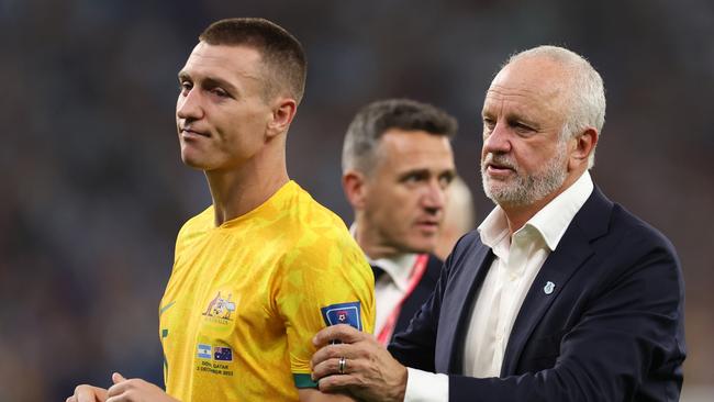 Mitch Duke and Graham Arnold after Australia’s defeat to Argentina in the Round of 16 at the World Cup. (Photo by Francois Nel/Getty Images)