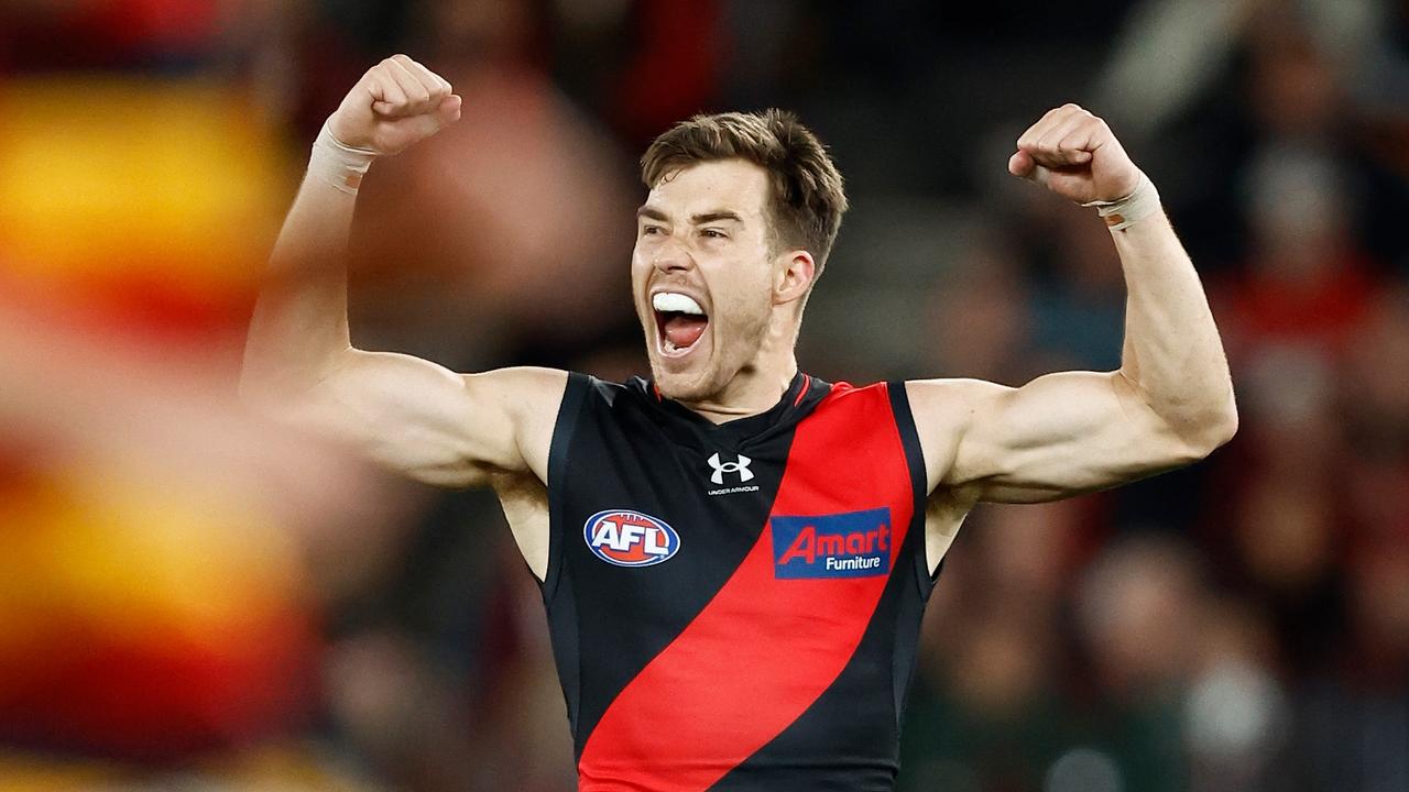 MELBOURNE, AUSTRALIA - JULY 09: Zach Merrett of the Bombers celebrates a goal during the 2023 AFL Round 17 match between the Essendon Bombers and the Adelaide Crows at Marvel Stadium on July 9, 2023 in Melbourne, Australia. (Photo by Michael Willson/AFL Photos via Getty Images)