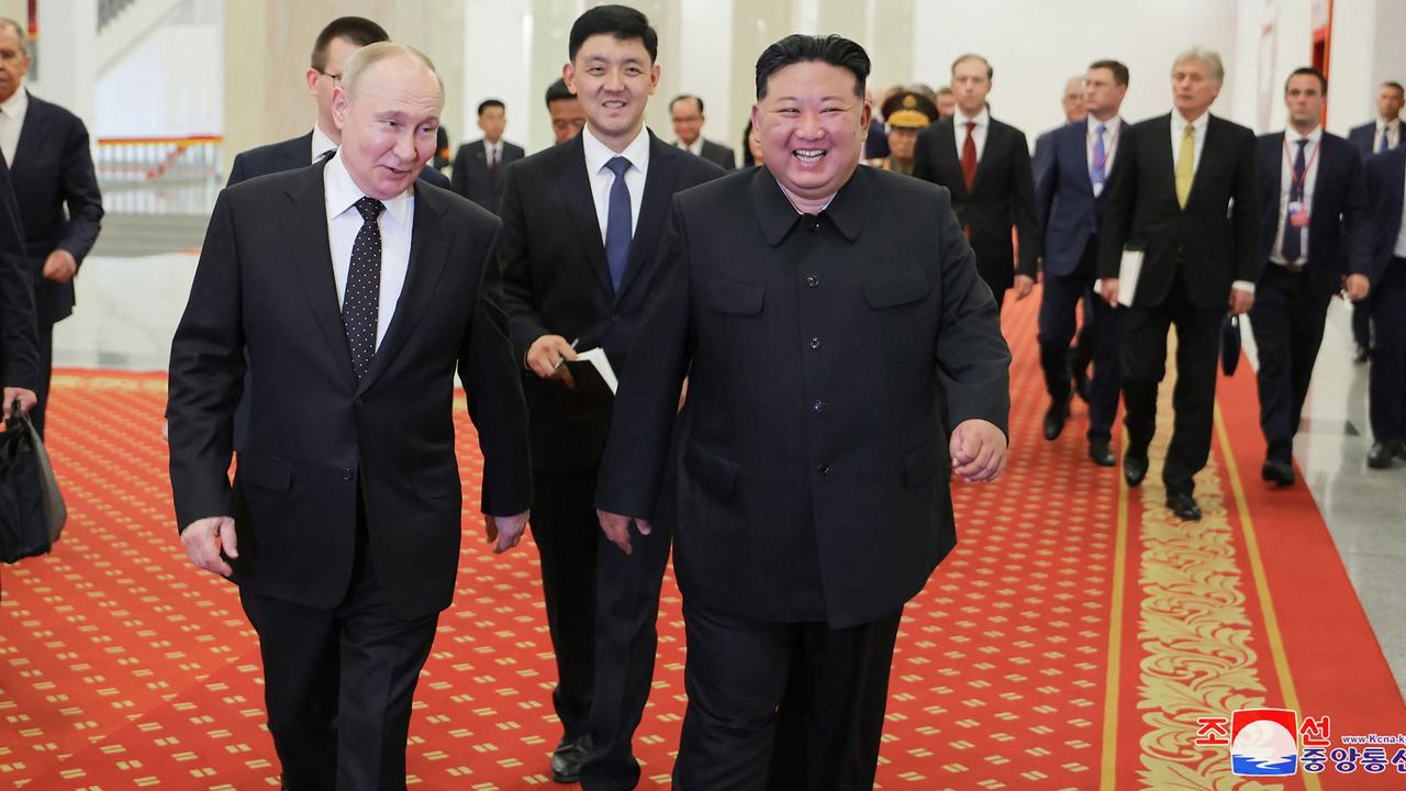 Kim Jong-un and Vladimir Putin beam after watching the welcome performance at the Pyongyang Gymnasium in Pyongyang. Picture: KCNA via KNS/AFP