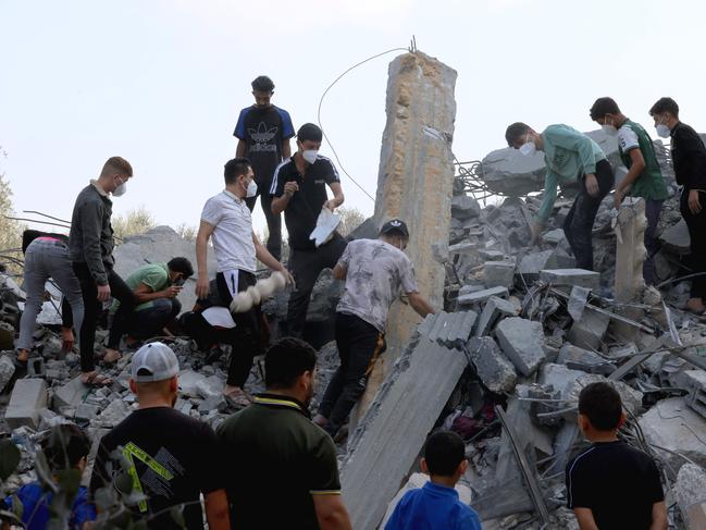 Palestinians search the rubble following an Israeli strike, as fighting between Israel and the Hamas movement continue in the city Rafah, in the southern Gaza Strip. Picture: AFP