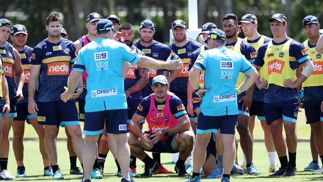 Titans players get to work in the pre-season. Picture: Nigel Hallett