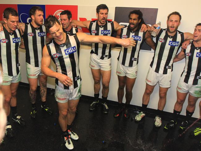 Kyle Martin in the middle of a Magpies celebration.